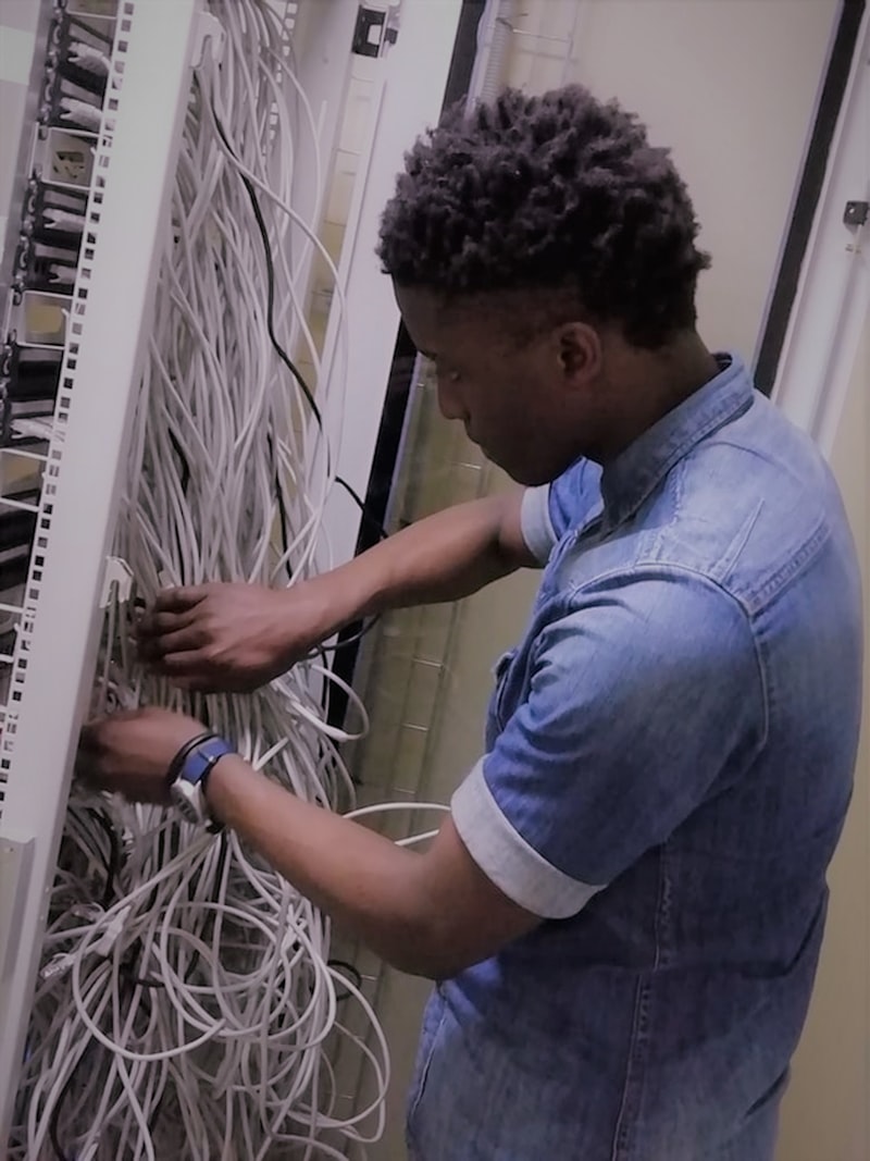 Engineer working on structured network cabling